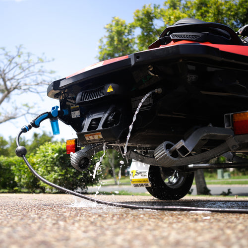 "Flushing a jet ski engine as part of the correct maintenance process."